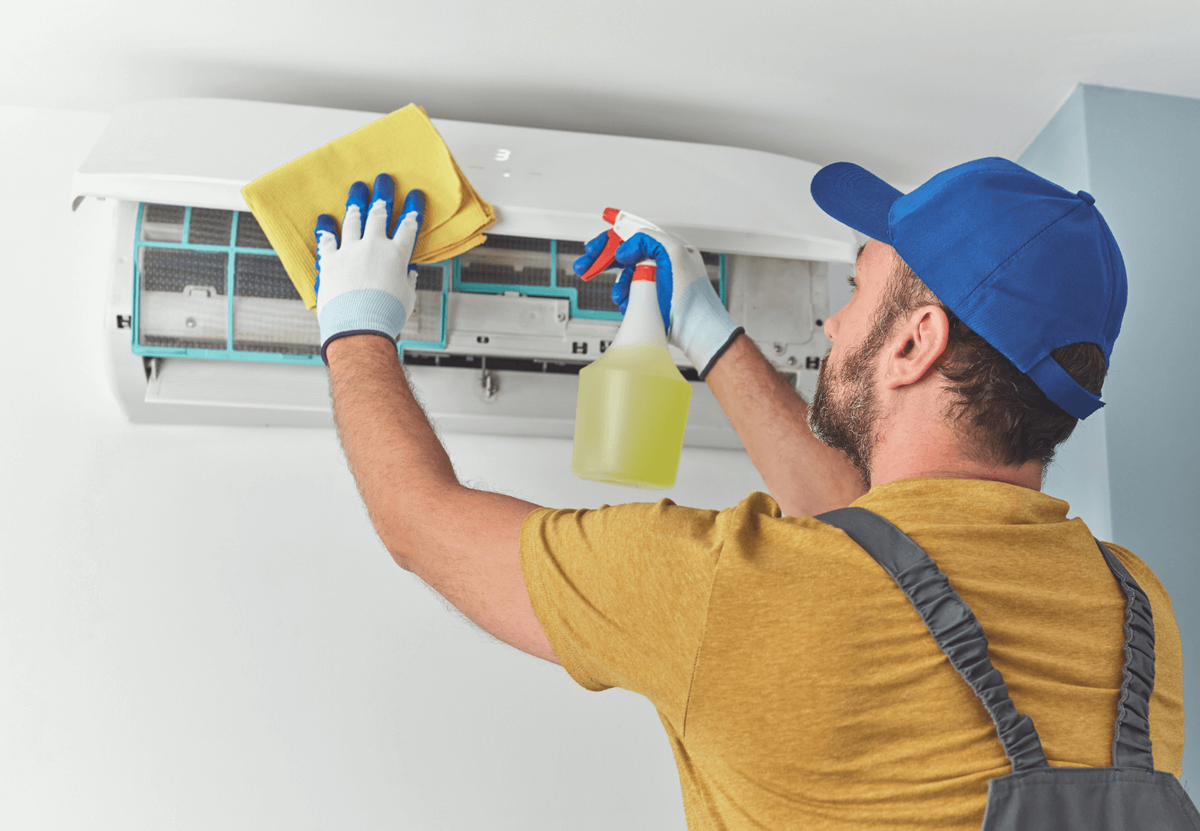 AC technician servicing unit in Dubai home